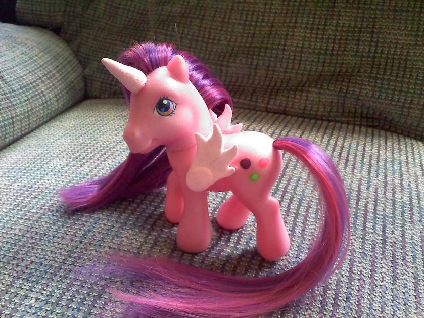 Pony made for my niece. Body original color, hair new, horn and wings added and symbol painted on.