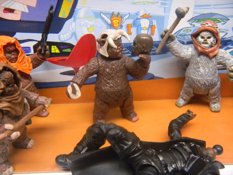 The Ewoks take a trophy of their victory.