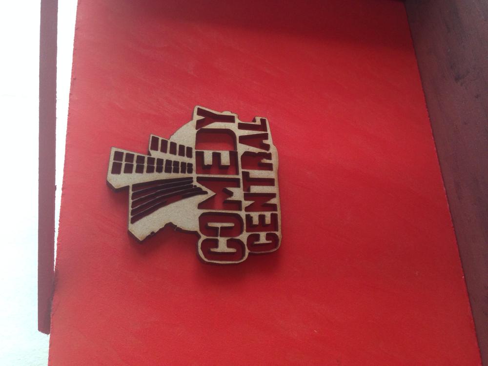 Wooden Comedy Central name laser cutted out of wood